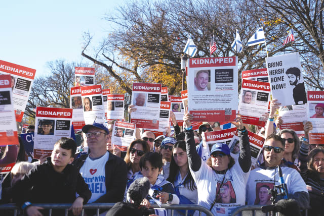  A rally in support of Israel that took place in November in Washington. Israel should inspire American Jews to focus less on what they have been doing - defense - and shift to what they have not been doing - attack, says the writer. (photo credit: REUTERS/Elizabeth Franz)