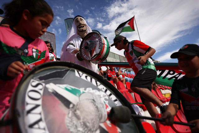 Palestino fans in the stands before the match. Palestino club was founded by Chile's Palestinian community. The club has been very active in support of the community amid the ongoing conflict between Israel and Hamas. (photo credit: REUTERS/IVAN ALVARADO)