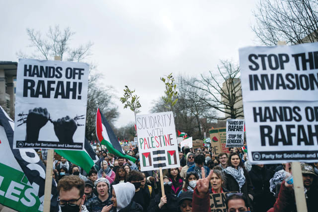  PRO-PALESTINIAN demonstrators march outside the Israel Embassy in Washington, calling for a ceasefire in Gaza, earlier this month. These calls demand that Israel stop attacking Hamas in Gaza but don’t mandate that Hamas stops fighting against Israel, the writer argues.  (photo credit: Bonnie Cash/Reuters)