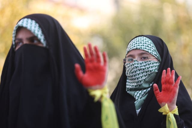  Women members of Basij paramilitary forces attend a rally in support of Palestinians, in Tehran, Iran, November 24, 2023. (photo credit: VIA REUTERS)