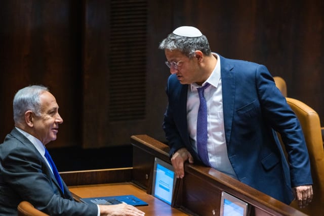  Likud leader MK Benjamin Netanyahu with Head of the Otzma Yehudit party MK Itamar Ben Gvir at a vote in the assembly hall of the Knesset, the Israeli parliament in Jerusalem, on December 28, 2022. (photo credit: OLIVIER FITOUSSI/FLASH90)