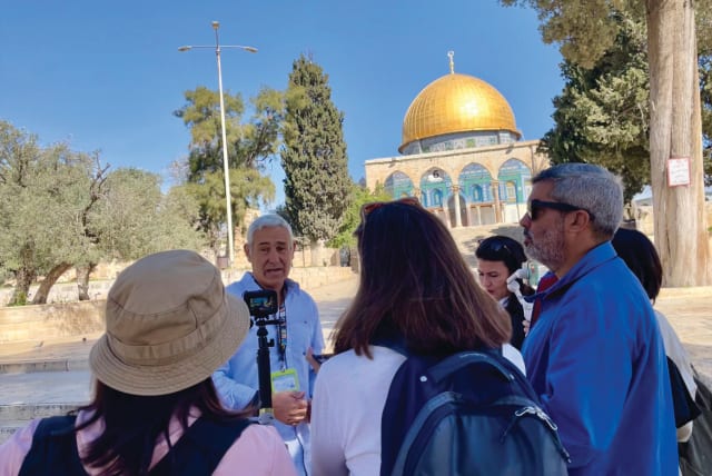  FOREIGN REPORTERS visit al-Aqsa Mosque at the beginning of Ramadan last week and receive a briefing from Ami Meitav, a former Shin Bet coordinator for the Temple Mount Basin, during a tour organized by the Jerusalem Press Club. (photo credit: Courtesy Rebecca Dinar)