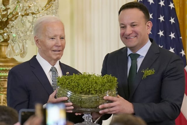 Taoiseach Leo Varadkar and US President Joe Biden during the St Patrick's Day Reception and Shamrock Ceremony in the the East Room of the White House, March 17, 2024.  (photo credit: NIALL CARSON/PA IMAGES VIA GETTY IMAGES)