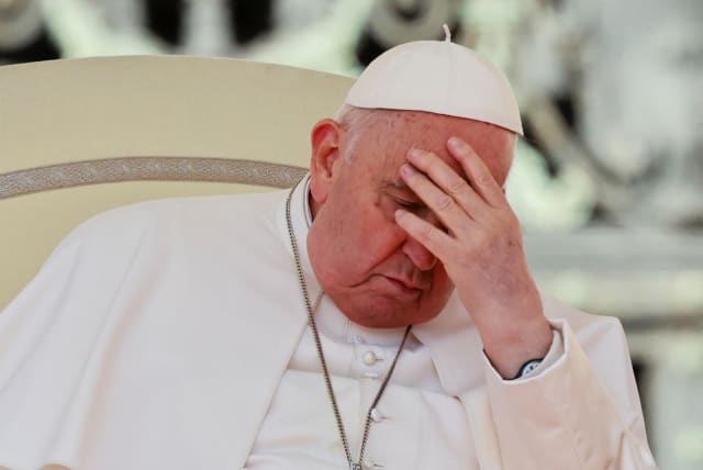  Pope Francis reacts during the weekly general audience in St. Peter's Square at the Vatican, March 20, 2024. (photo credit: REUTERS/YARA NARDI)