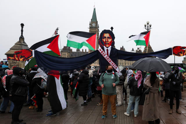  Protesters hold an effigy of Canada’s PM Justin Trudeau during a rally to call for a ceasefire in Ottawa (photo credit: REUTERS/Ismail Shakil)