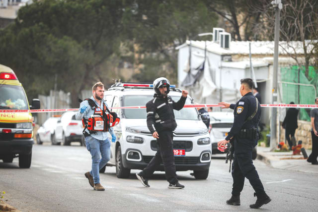  SECURITY AND rescue personnel are at the scene of a stabbing attack in Jerusalem’s Neve Yaakov neighborhood, earlier this month. The attacker was a 14-year-old resident of Jerusalem.  (photo credit: JAMAL AWAD/FLASH90)