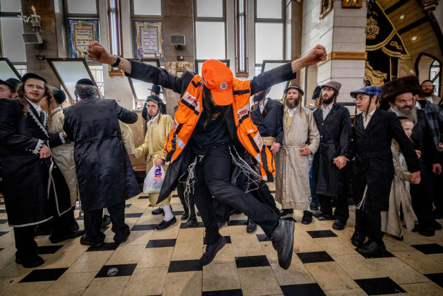  Haredi (ultra-Orthodox) Jewish Israelis are seen dancing in costume amid the holiday of Purim, in Mea She'arim in Jerusalem, on March 8, 2023. (photo credit: YONATAN SINDEL/FLASH90)