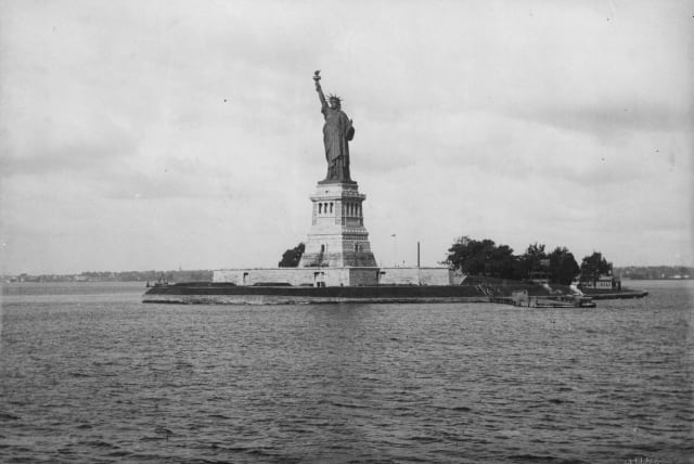  THE STATUE of Liberty in New York Harbor, 1893. ‘The New Colossus’ by poet Emma Lazarus is mounted on the statue’s pedestal.  (photo credit: Loeffler/Fox Photos/Getty Images)