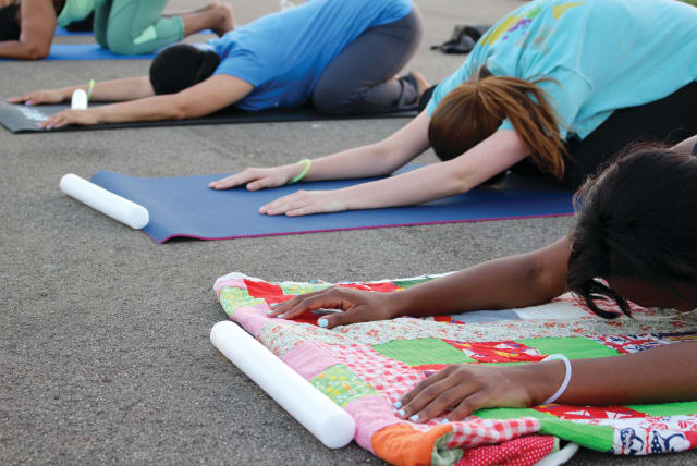  An illustrative image of people doing yoga. (photo credit: A Healthier Michigan/Flickr)