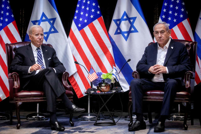  U.S. President Joe Biden, left, pauses during a meeting with Israeli Prime Minister Benjamin Netanyahu, right, to discuss the war between Israel and Hamas, in Tel Aviv, Israel, Wednesday, Oct. 18, 2023. (photo credit: Miriam Alster/Pool via REUTERS//File Photo)