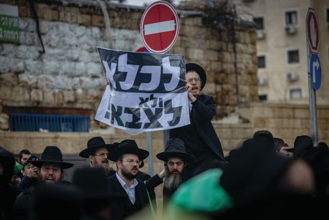  ULTRA-ORTHODOX men protest against the haredi draft, in Jerusalem last week. (photo credit: YONATAN SINDEL/FLASH90)