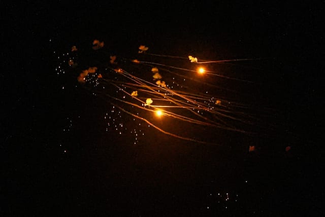  Iron dome anti-missile system fires interception missiles as rockets fired from Lebanon, as it seen over Kiryat Shmona, March 5, 2024. (photo credit: AYAL MARGOLIN/FLASH90)