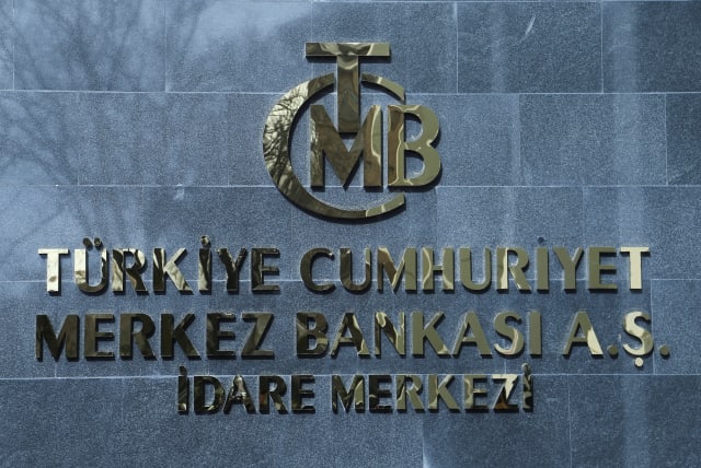  A logo of Turkey's Central Bank is pictured at the entrance to its headquarters in Ankara, Turkey February 8, 2024. (photo credit: REUTERS/CAGLA GURDOGAN)