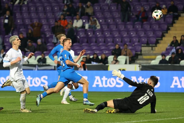  ICELAND'S ALBERT GUDMUNDSSON (center) scores his side’s third goal past Israel ’keeper Omri Glazer during the Nordic nation’s 4-1 victory over the blue-and-white in their Euro 2020 Play-Off in Budapest. (photo credit: Bernadett Szabo/Reuters)