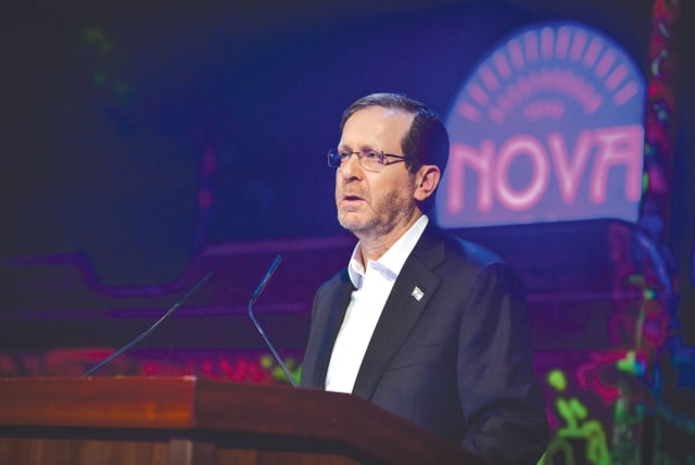  PRESIDENT ISAAC Herzog attends the opening in Tel Aviv in December of an exhibition of objects collected at the site of the Nova music festival. (photo credit: AVSHALOM SASSONI/FLASH90)