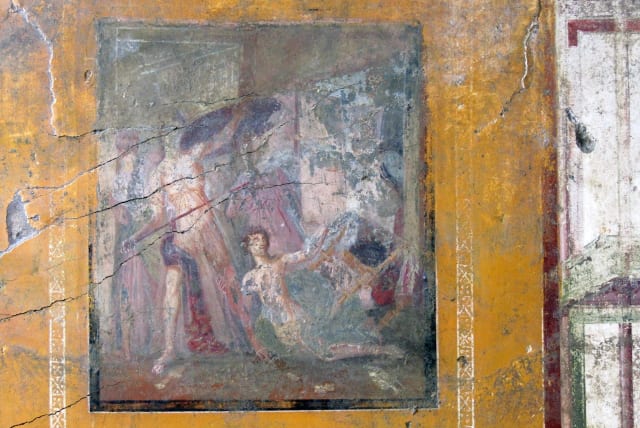 A fresco covers the wall at the room of an ancient domus during archaeological excavations in the ancient archeological site of Pompeii, Italy, in this handout photo obtained by Reuters on March 25, 2024. (photo credit: Parco archeologico di Pompei/Handout via REUTERS)