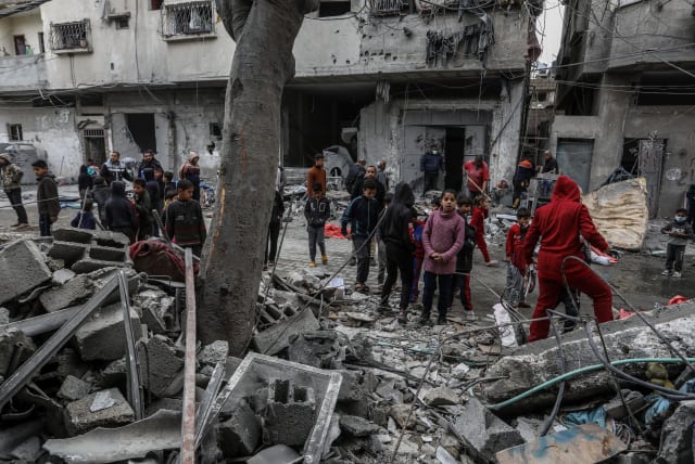  Palestinians at the site of an Israeli air strike in Rafah, in the southern Gaza Strip, on March 24, 2024. (photo credit: ABED RAHIM KHATIB/FLASH90)