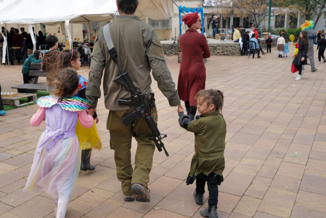  Israelis of all ages enjoy Purim despite a drone attack earlier, Moshav Nov, Golan Heights on March 24, 2024. (photo credit: MICHAEL GILADI/FLASH90)