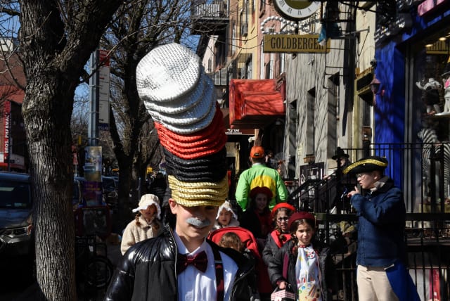  Children wear costumes during celebrations to mark the Jewish holiday of Purim, in the Brooklyn borough of New York City, U.S. March 7, 2023. (photo credit: STEPHANIE KEITH/REUTERS)