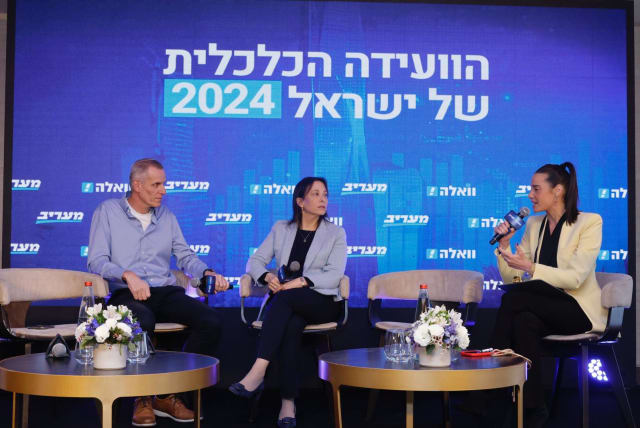  Dafna Landau, (center) Head of the Construction & Real Estate sub-division in Bank Leumi’s Business Division, speaks with Yaakov Quint, Director-General of the Israel Land Authority (left) and journalist Danielle Roth Avneri at the Maariv Economic Conference in Tel Aviv. (photo credit: AVSHALOM SASSONI)