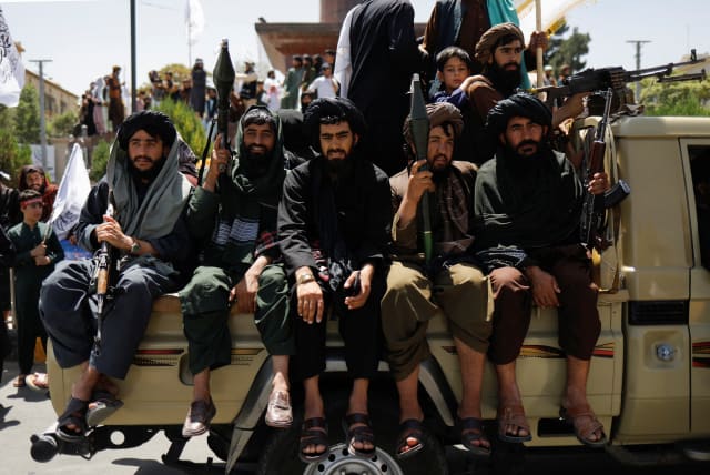  Taliban members on the second anniversary of the fall of Kabul, near the US embassy in the Afghan capital, Aug. 15, 2023 (photo credit: ALI KHARA/REUTERS)