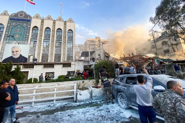  Smoke rises after what the Iranian media said was an Israeli strike on a buidling close to the Iranian embassy in Damascus, Syria April 1, 2024. (photo credit: REUTERS/FIRAS MAKDESI)