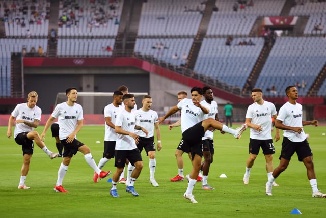  Germany players during the warm up before the match. (photo credit: REUTERS/AMR ABDALLAH DALSH)