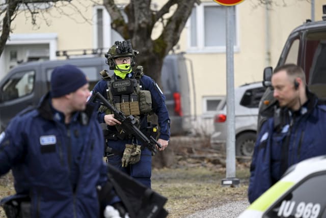  Police officers operate at the Viertola comprehensive school in Vantaa, Finland, on April 2, 2024. Three minors were injured in a shooting at the school on Tuesday morning. A suspect, also a minor, has been apprehended. (photo credit: Lehtikuva/Markku Ulander via REUTERS.)