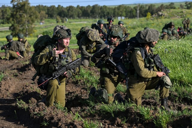  IDF Reserve infantrymen take part in a military maneuver of their battalion in Golan Heights, on April 1, 2024 (photo credit: MICHAEL GILADI/FLASH90)