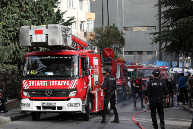 Police officers arrive the scene after a fire broke out aat a nightclub in Istanbul, Turkey April 2, 2024 (photo credit: REUTERS/MURAD SEZER)