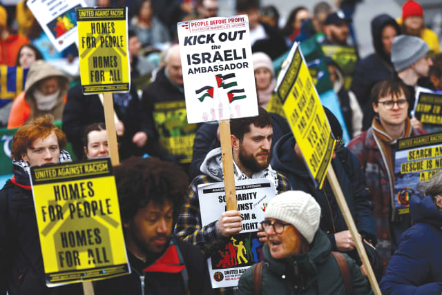  A demonstrator holds a sign calling for the expulsion of Israel's Ambassador to Ireland Dana Erlich, in support of Palestine, at a march against war, hate, and racism, in Dublin, last month. Many people outside of Israel have lost track of why we are fighting this war, the writer argues. (photo credit: CLODAGH KILCOYNE/REUTERS)