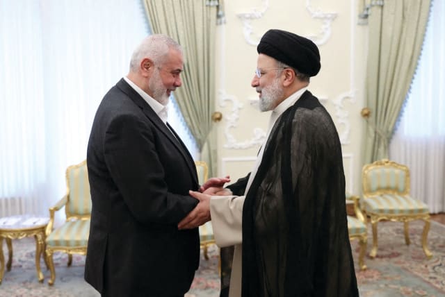  Iranian President Ebrahim Raisi meets with Hamas leader Ismail Haniyeh, in Tehran, last week. (photo credit: Iran's Presidency/West Asia News Agency/Reuters)