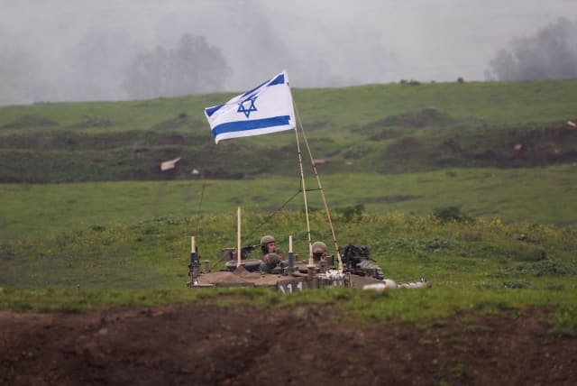 Israeli soldiers use a tank during a military drill in the Golan Heights, February 20, 2024 (photo credit: REUTERS/AMIR COHEN)