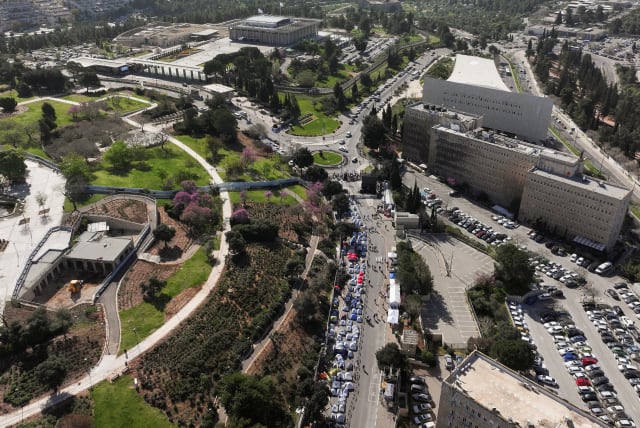  A drone view shows Israeli protesters demanding Israel's Prime Minister Benjamin Netanyahu's ouster, in the wake of the deadly October 7 attack on Israel by the Palestinian Islamist group Hamas and the ensuing war in Gaza, in front of the Knesset, Israeli parliament in Jerusalem, April 1, 2024. (photo credit: REUTERS/ILAN ROSENBERG)
