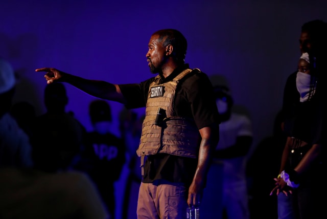  Rapper Kanye West calls for a question from the crowd as he holds his first rally in support of his presidential bid in North Charleston, South Carolina, U.S. July 19, 2020.  (photo credit: RANDALL HILL/REUTERS)