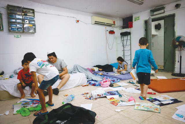  Israeli children in an Ashkelon bomb shelter, October 8, 2024, just one day after the October 7 massacre. (photo credit: FLASH90)