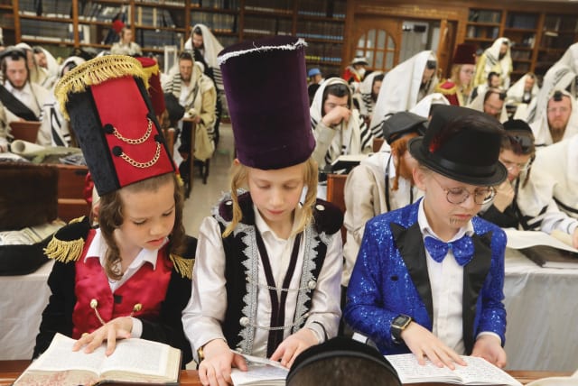  ULTRA-ORTHODOX CHILDREN follow a Scroll of Esther reading in Beit Shemesh (photo credit: FLASH90)