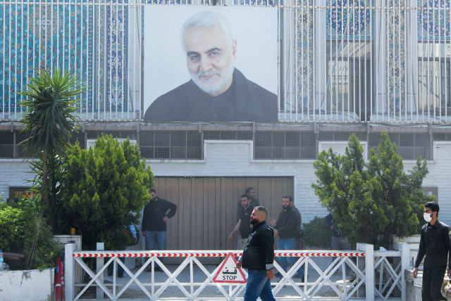  A PICTURE of previously assassinated senior Iranian military commander Gen. Qasem Soleimani is placed on the Iranian Embassy building in Damascus after a suspected Israeli strike on Iran’s adjacent consulate killed key Quds Force figures.  (photo credit: FIRAS MAKDESI/REUTERS)