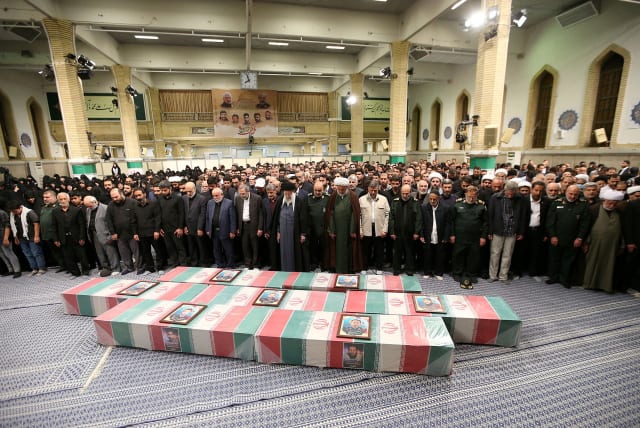  Iran's Supreme Leader, Ayatollah Ali Khamenei pray next to the Coffins of members of the Islamic Revolutionary Guard Corps who were killed in the airstrike on the Iranian embassy complex in the Syrian capital Damascus, during a funeral ceremony in Tehran, Iran April 4, 2024. (photo credit: Office of the Iranian Supreme Leader/WANA (West Asia News Agency)/Handout via REUTERS)