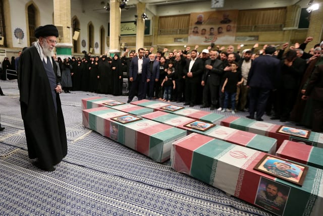  Iran's Supreme Leader, Ayatollah Ali Khamenei looks at the coffins of members of the Islamic Revolutionary Guard Corps who were killed in the Israeli airstrike on the Iranian embassy complex in the Syrian capital Damascus, during a funeral ceremony in Tehran, Iran April 4, 2024 (photo credit: Office of the Iranian Supreme Leader/WANA/Handout via Reuters)