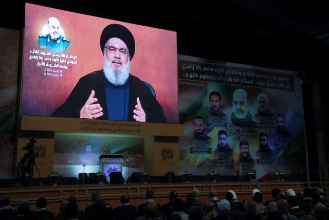  Lebanon's Hezbollah leader Sayyed Hassan Nasrallah gives a televised address to mark one week since a suspected Israeli strike on Iran's consulate in Damascus that killed several Iranian Quds Force figures, including a top commander, in Beirut's southern suburbs, Lebanon April 8, 2024.  (photo credit: MOHAMED AZAKIR/REUTERS)