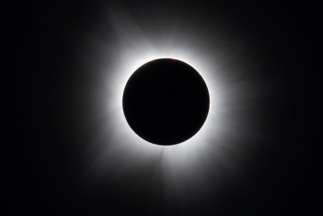 A total solar eclipse is seen in Dallas, Texas, U.S., April 8, 2024. (photo credit: NASA/Keegan Barber/Handout via REUTERS)