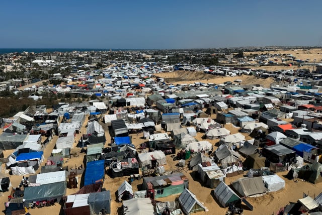  Displaced Palestinians, who fled their houses due to Israeli strikes, shelter in a tent camp, amid the ongoing conflict between Israel and the Palestinian Islamist group Hamas, in Rafah, in the southern Gaza Strip March 11, 2024. (photo credit: REUTERS/BASSAM MASOUD)