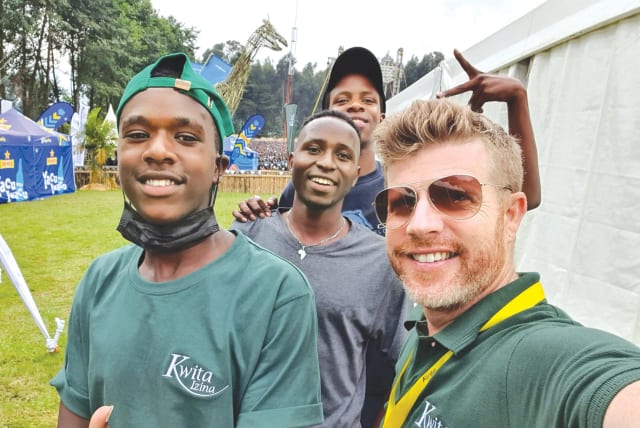  THE WRITER spends time with some Rwandan friends at the ‘Kwita Izina’ ceremony in September 2022. Rwanda’s recovery illustrated the nation’s remarkable transformation through unity and a profound connection to nature, the writer says. (photo credit: NOAM BEDEIN)