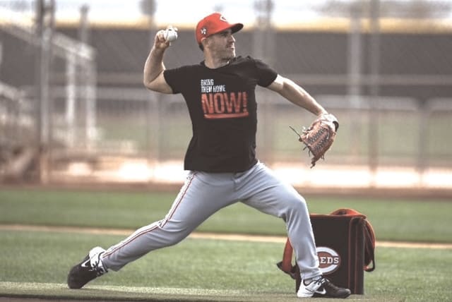  ISRAEL’S ALON LEICHMAN wears a “Bring Them Home Now” T-Shirt in his role as a pitching coach with the Cincinnati Reds. Inset: Leichman’s custom designed glove.  (photo credit: Alon Leichman/Courtesy)