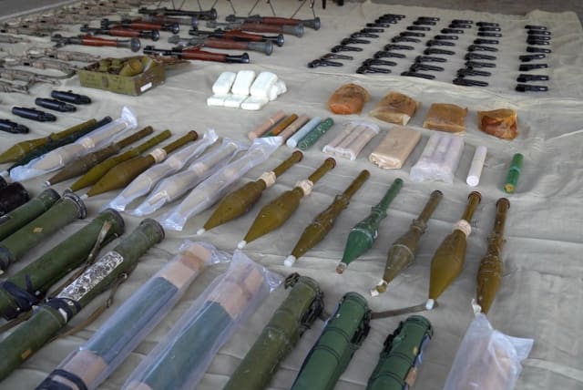  A screengrab from a video released on March 25, 2024 by the Israeli army shows what they say are Iranian weapons that were seized by the Israel Security Agency and by the Israel Defense Forces, at an unknown location.  (photo credit: Israeli Army Handout/Handout via REUTERS )