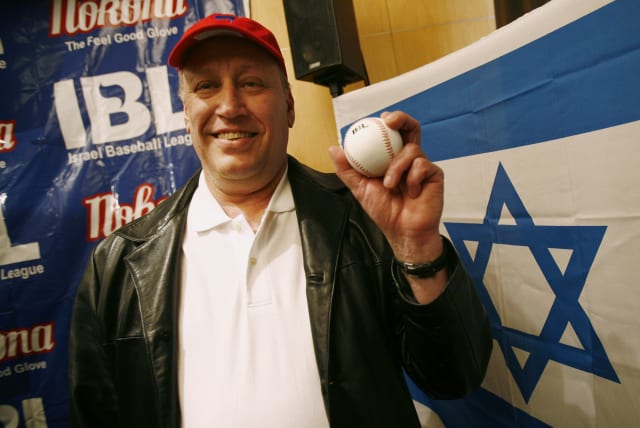 Ken Holtzman, the winningest Jewish pitcher in major league baseball history, poses with the official Israel Baseball League baseball after a press conference announcing the inaugural season in New York, February 26, 2007. (photo credit: REUTERS/SHANNON STAPLETON)