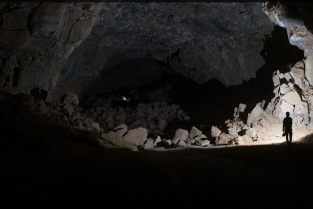   Researchers exploring the Umm Jirsan Lava Tube system. (photo credit: CREATIVE COMMONS)