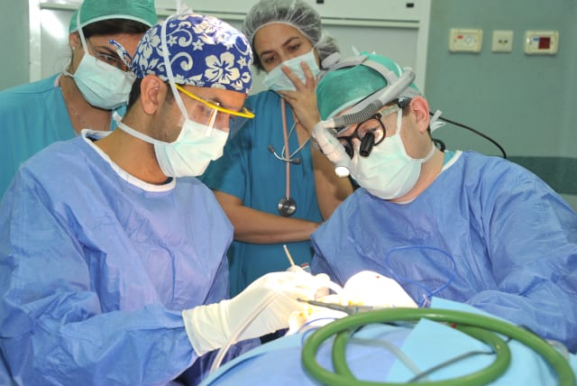 Neurosurgeon performs surgery on epileptic 10 month old baby (photo credit: RONI ALBERT)