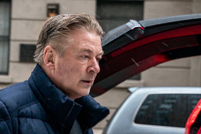  Actor Alec Baldwin departs his home, as he will be charged with involuntary manslaughter for the fatal shooting of cinematographer Halyna Hutchins on the set of the movie "Rust,” in New York, US January 31, 2023 (photo credit: REUTERS/DAVID 'DEE' DELGADO)